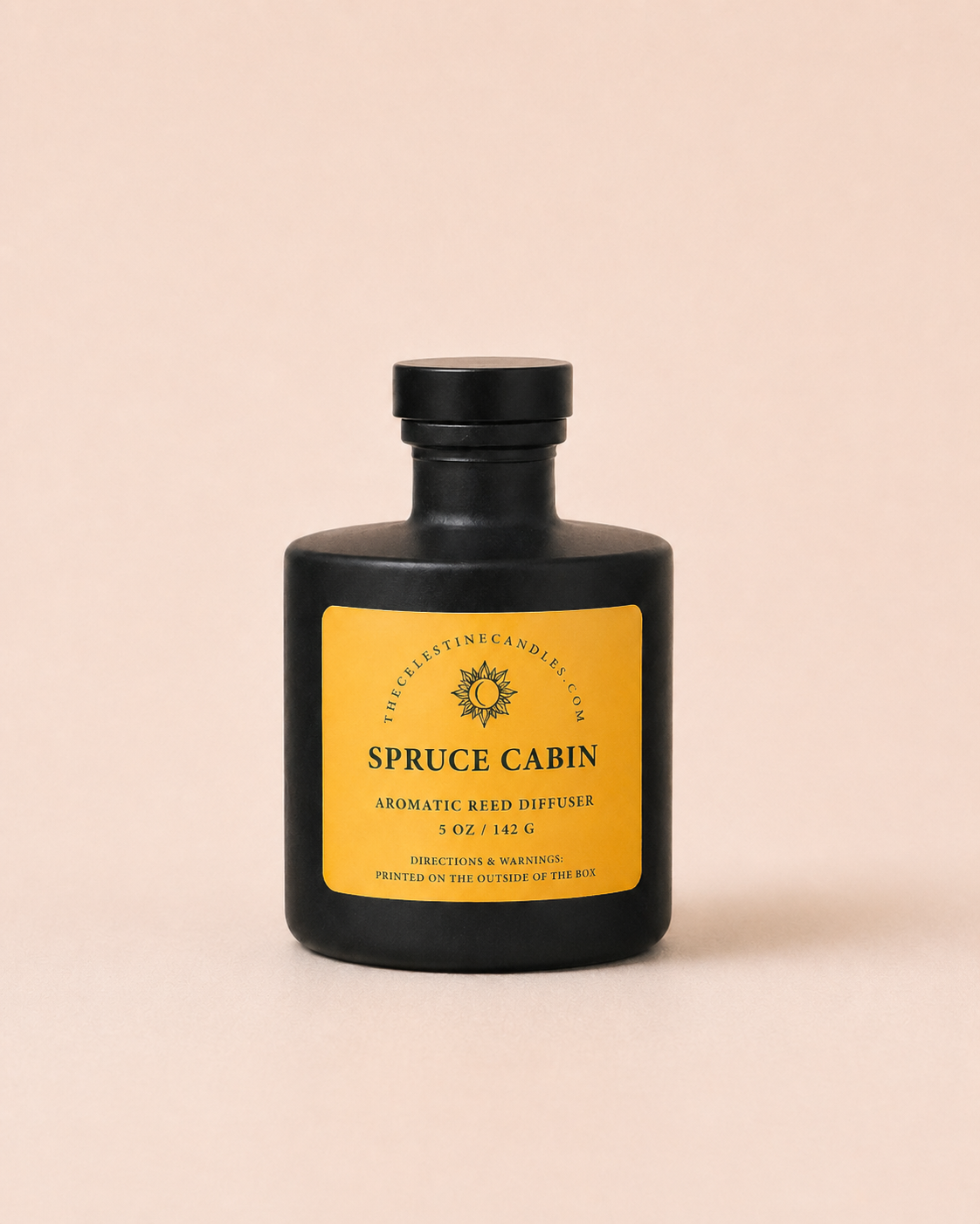 Black bottle of 'Spruce Cabin' diffuser with a yellow label on a beige background