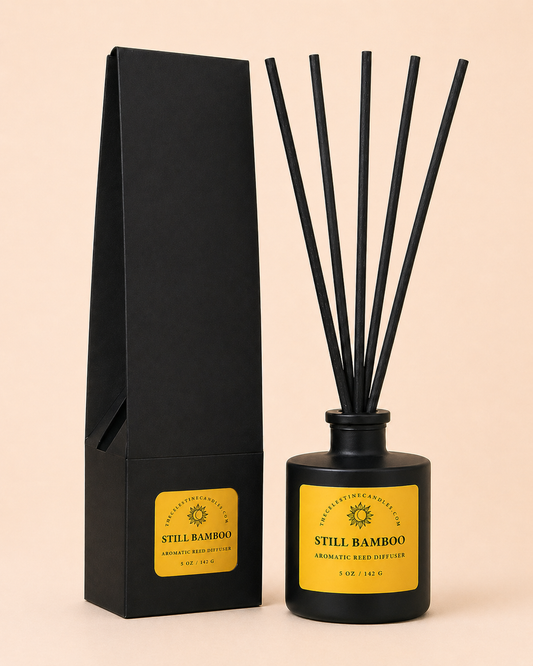 Black diffuser bottle with sticks and packaging labeled 'Still Bamboo' on a beige background