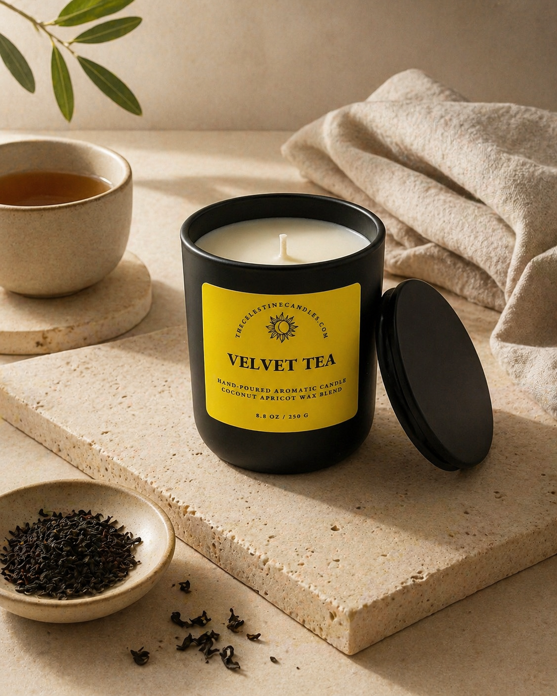 Velvet Tea coconut apricot wax candle in a premium matte black glass vessel with matching lid.