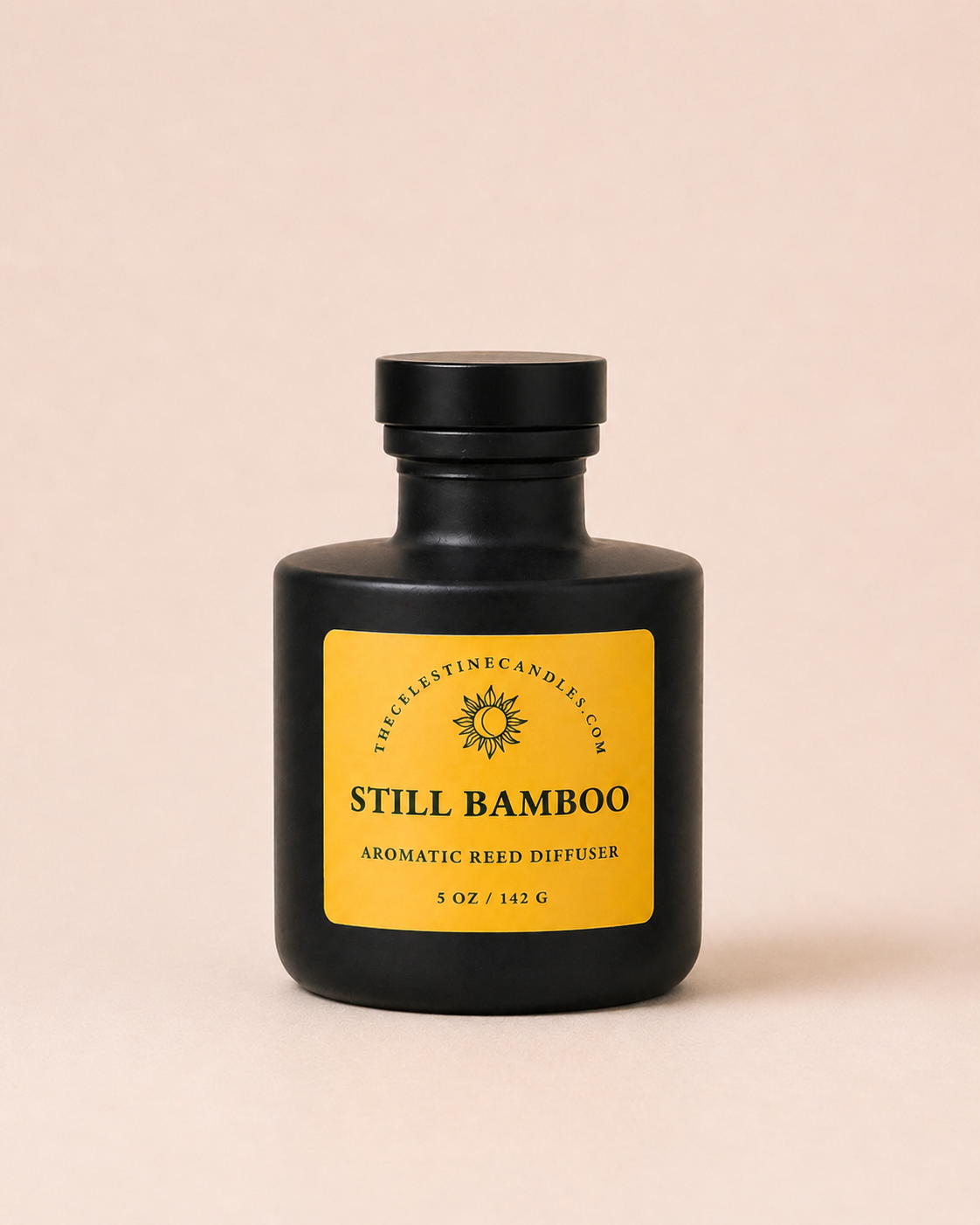 Still Bamboo reed diffuser in a matte black glass bottle on a neutral beige background.
